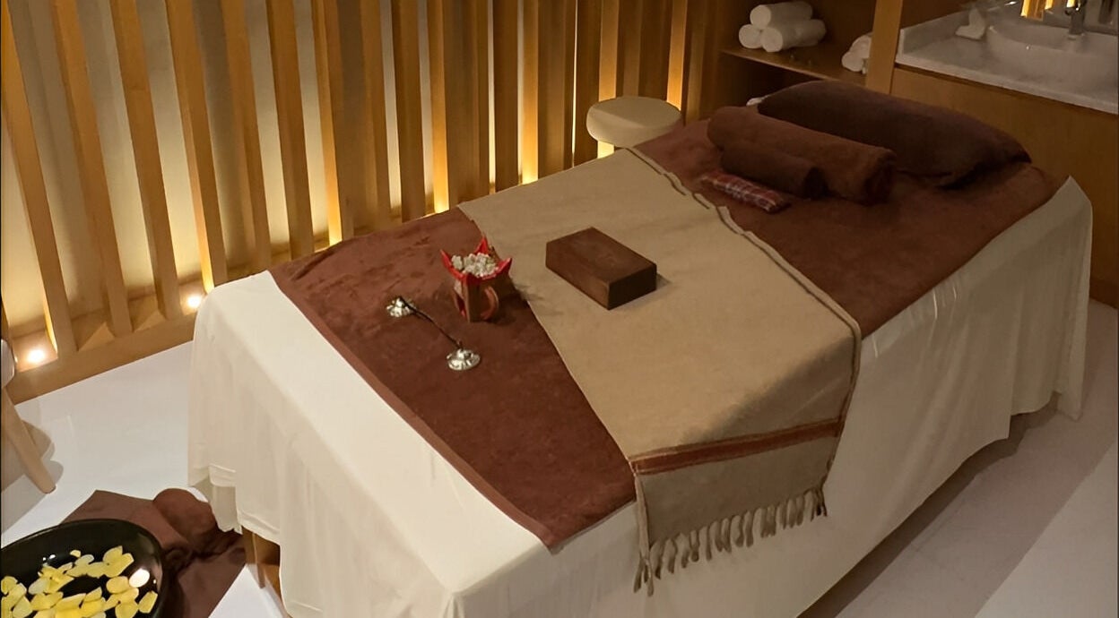 Massage table at Galo Spa, صلالة, محافظة ظفار, OM, with soft lighting and soothing ambiance.