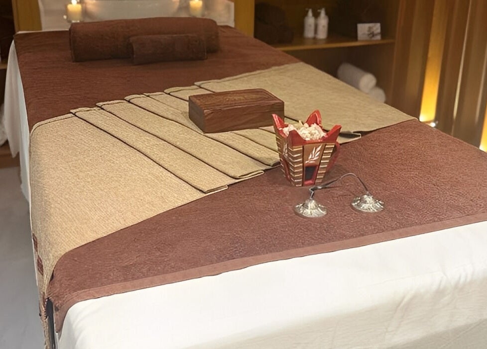 Luxurious massage table setup at Galo Spa, صلالة, محافظة ظفار, OM, featuring a peaceful ambiance.
