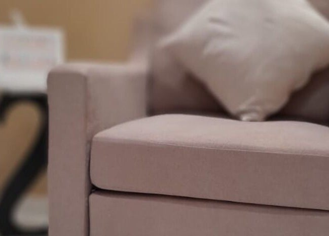 Soft beige armchair with pillow at Galo Spa, صلالة, محافظة ظفار, OM.