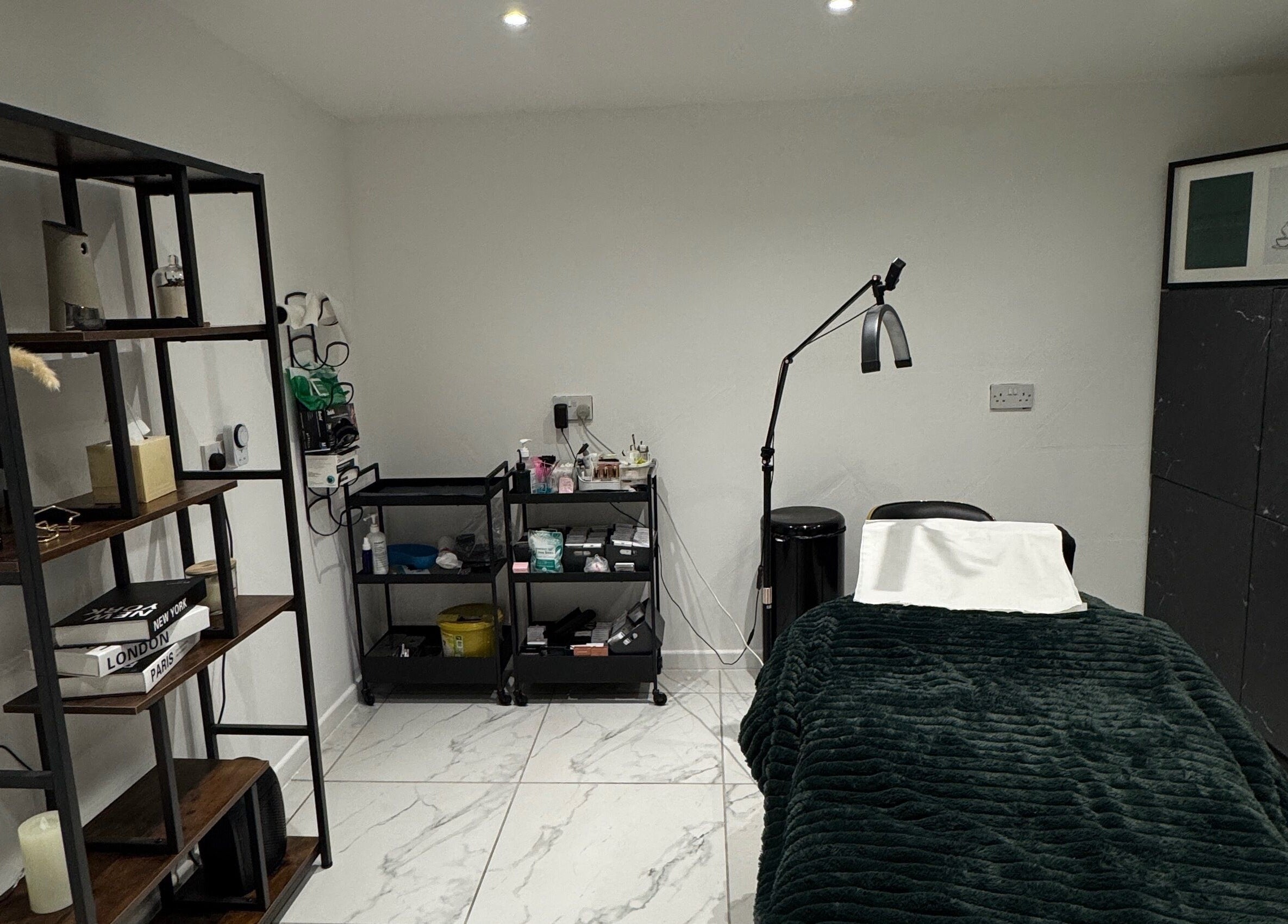 Spa room at The Beauty Mix Dartford, Dartford, England, GB featuring a cozy treatment bed and elegant decor.