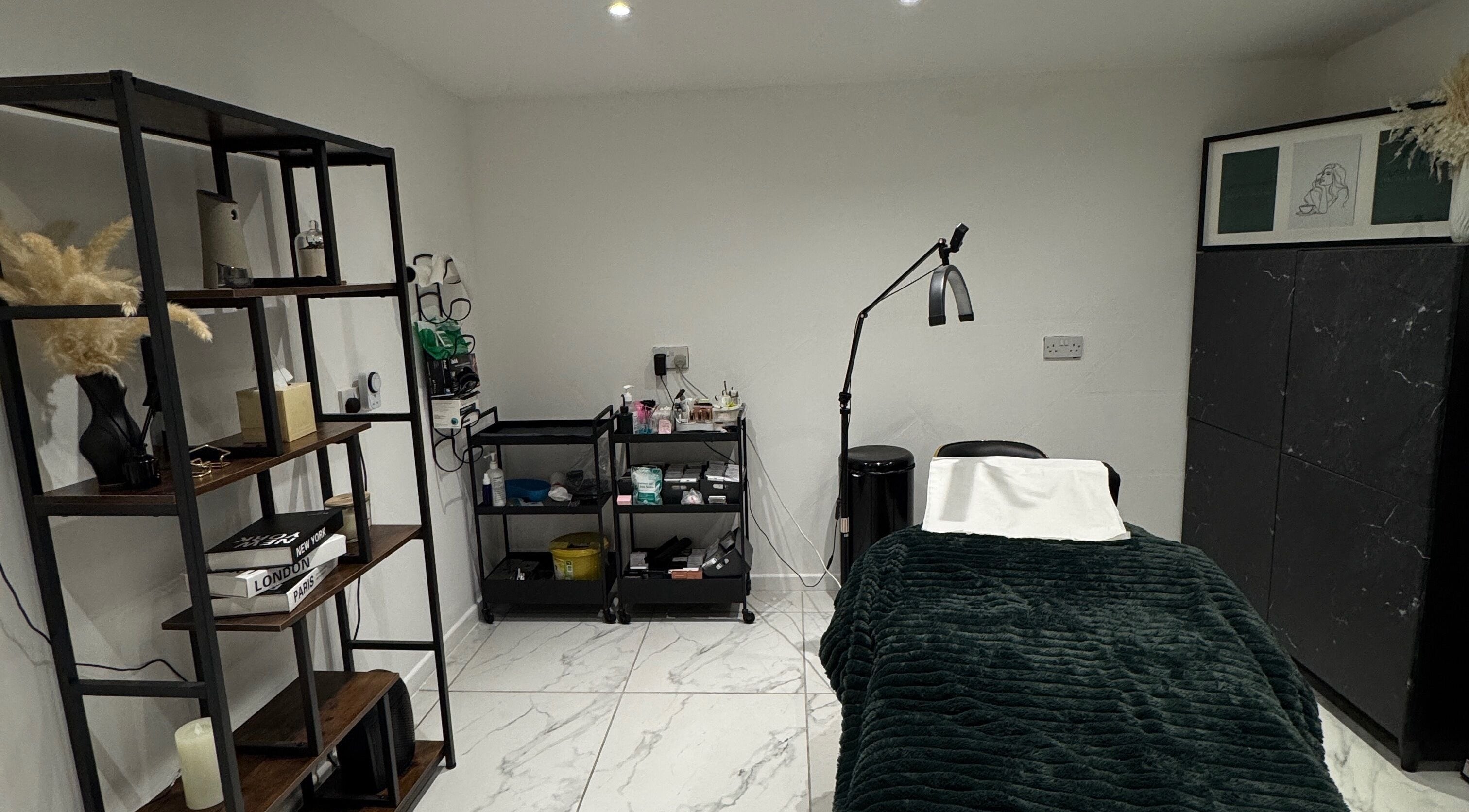 Spa room at The Beauty Mix Dartford, Dartford, England, GB featuring a cozy treatment bed and elegant decor.