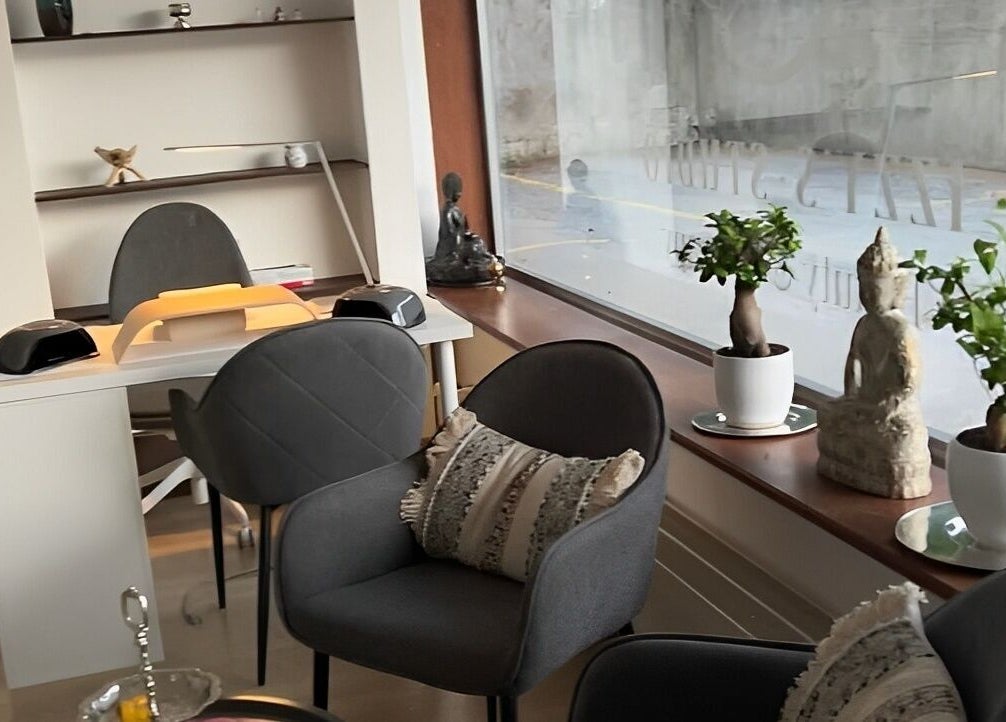 Interior view of Izzy's Studio, Val De Bagnes, Valais, CH, showcasing elegant seating and serene decor.