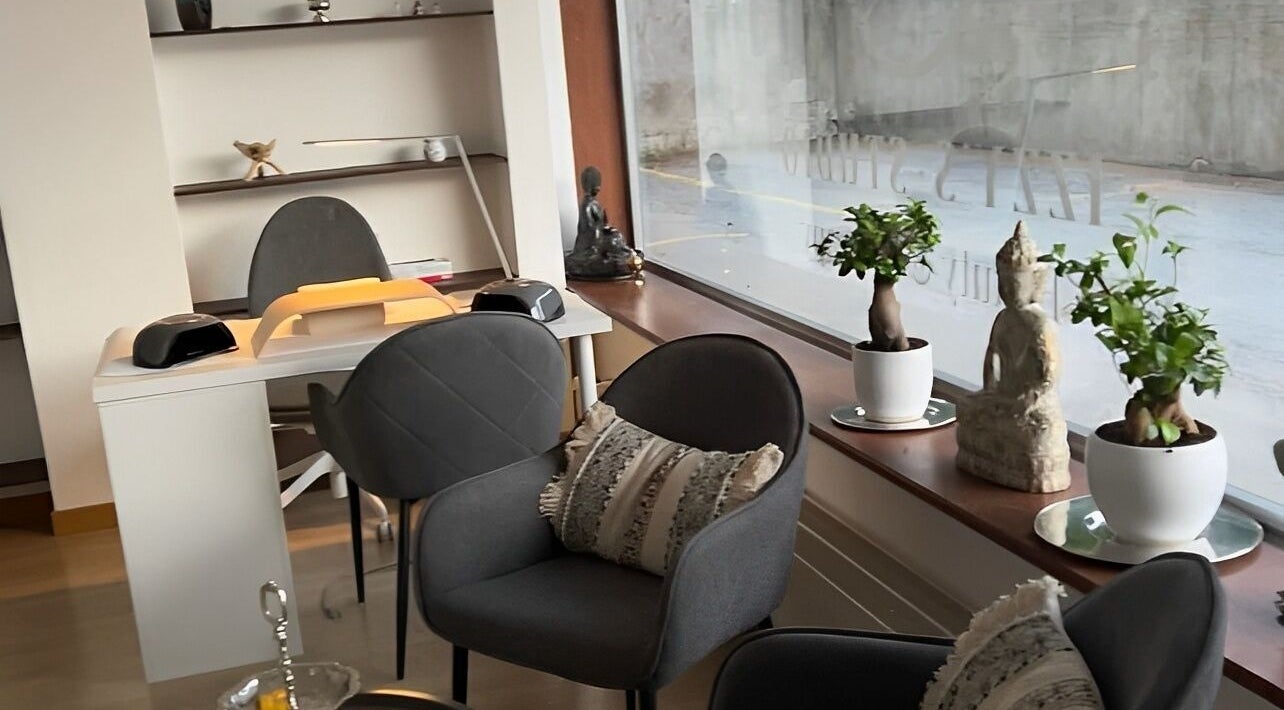 Interior view of Izzy's Studio, Val De Bagnes, Valais, CH, showcasing elegant seating and serene decor.