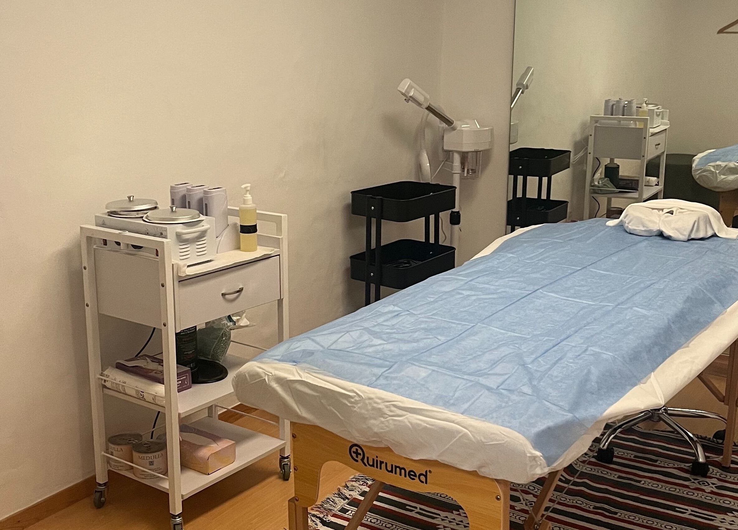 Serene massage room at Izzy Spa, Val De Bagnes, Valais, CH with a prepared treatment bed.