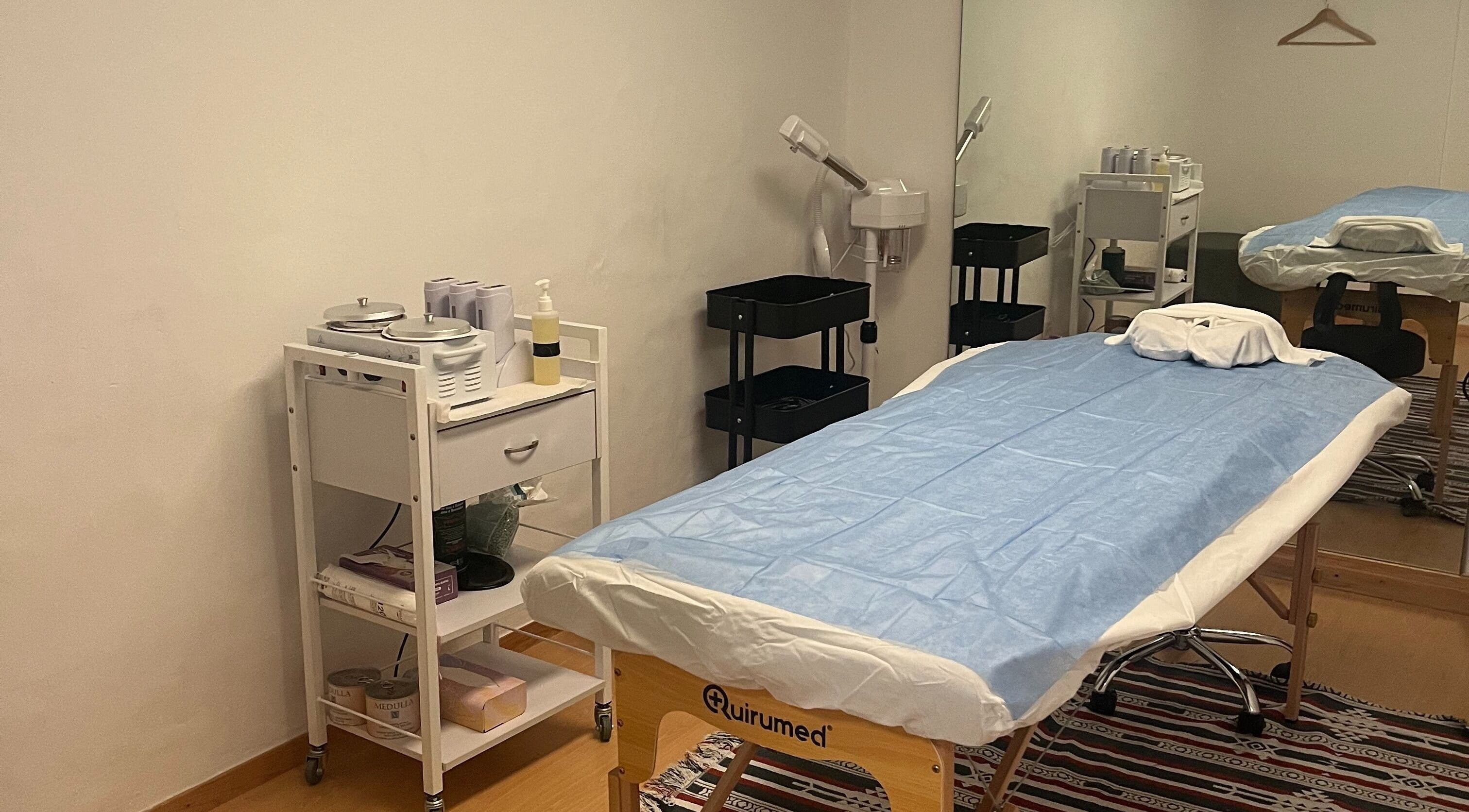 Massage room at Izzy Spa in Val De Bagnes, Valais, CH, featuring a treatment table and wellness tools.