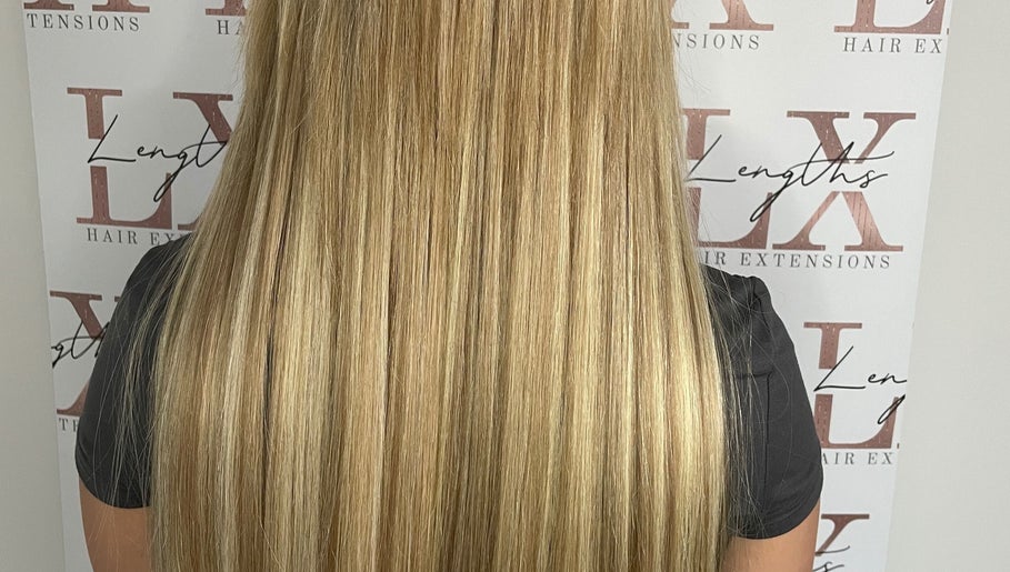 Long, sleek blonde hair extensions at LX Lengths Hair Extensions, Ash, England, GB.