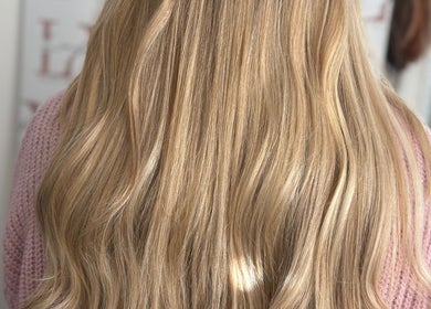 Luxe blonde hair extensions at LX Lengths Hair Extensions in Ash, England, GB. Shine and volume bring elegance.