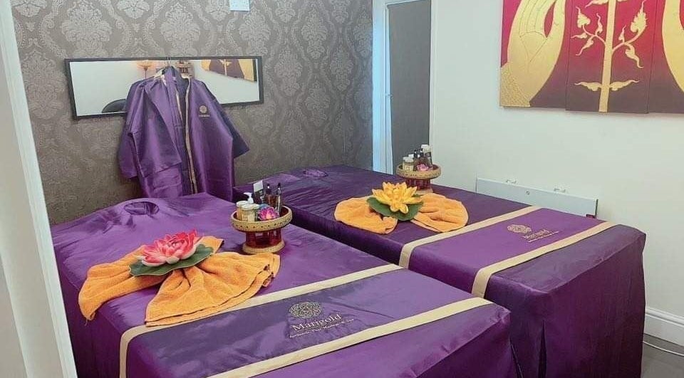 Relaxing therapy room at Marigold Thai Therapy in Cardiff, Wales, GB, featuring elegant decor and massage tables.