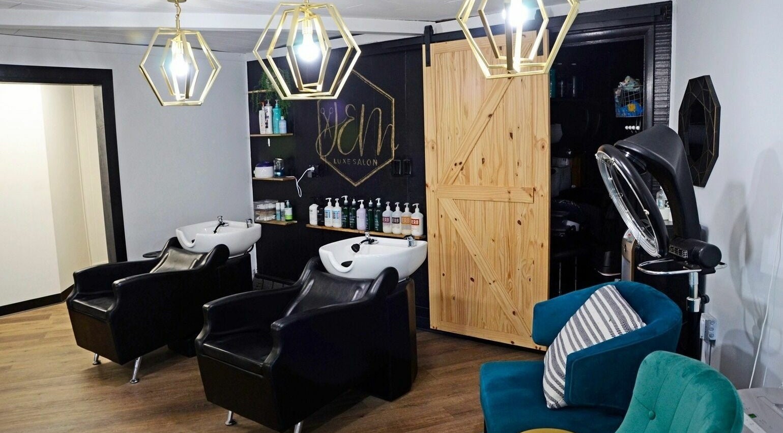 Luxurious interior of JEM Luxe Salon LLC, Coloma, Michigan, US featuring modern chairs and stylish lighting.