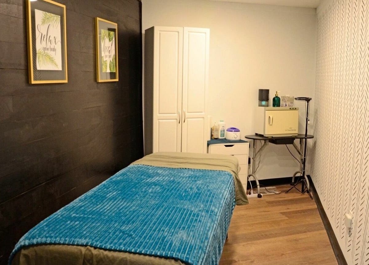 Relaxing treatment room at JEM Luxe Salon LLC, Coloma, Michigan, US, with stylish decor and cozy ambiance.