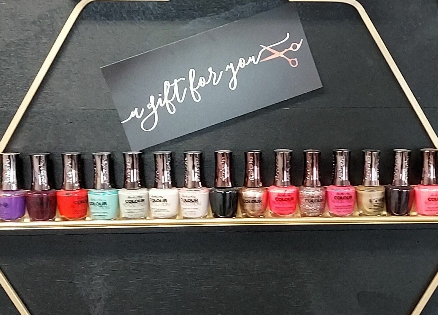 Colorful nail polish display at JEM Luxe Salon LLC, Coloma, Michigan, US, enhancing beauty options.
