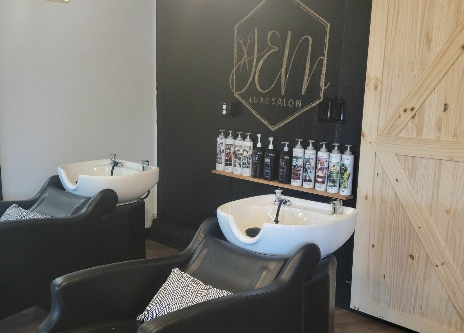 Luxurious wash stations at JEM Luxe Salon LLC, Coloma, Michigan, US, showcasing modern design and premium products.