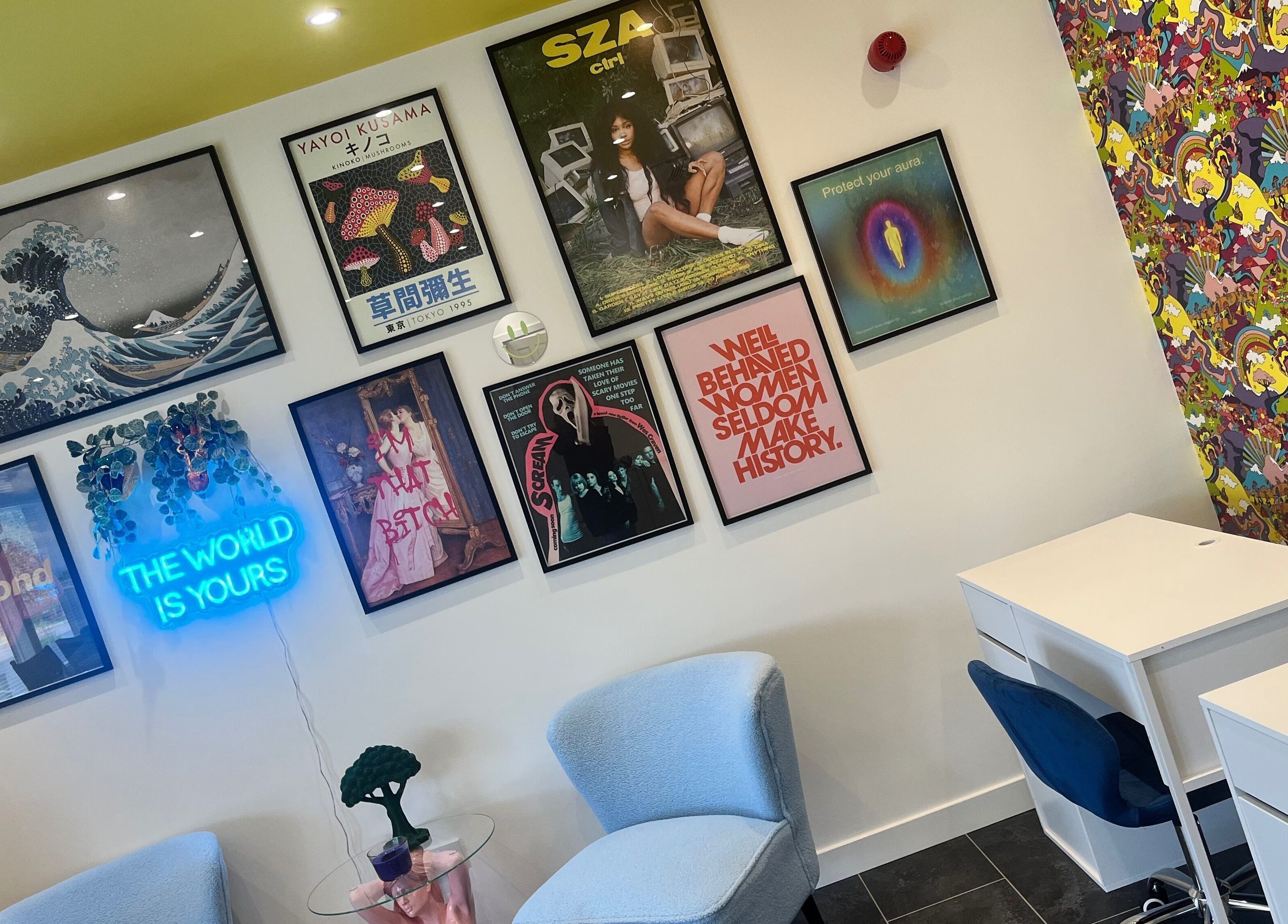 Vibrant interior of SPMU & Lashes by Klaudia in Livingston, Scotland, GB. Stylish decor with art and neon sign.