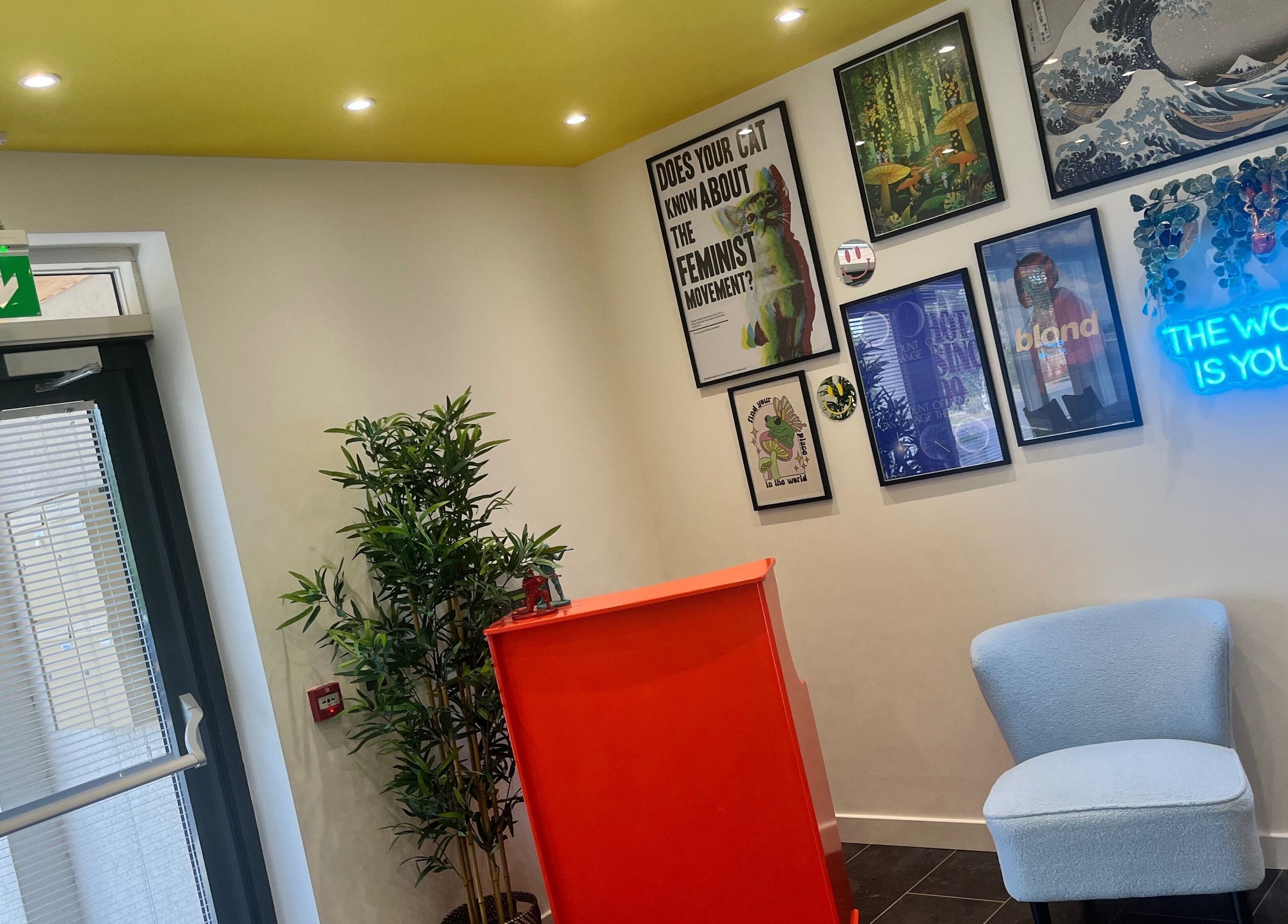 Bright reception area at SPMU & Lashes by Klaudia, Livingston, Scotland, GB with colorful decor and art.