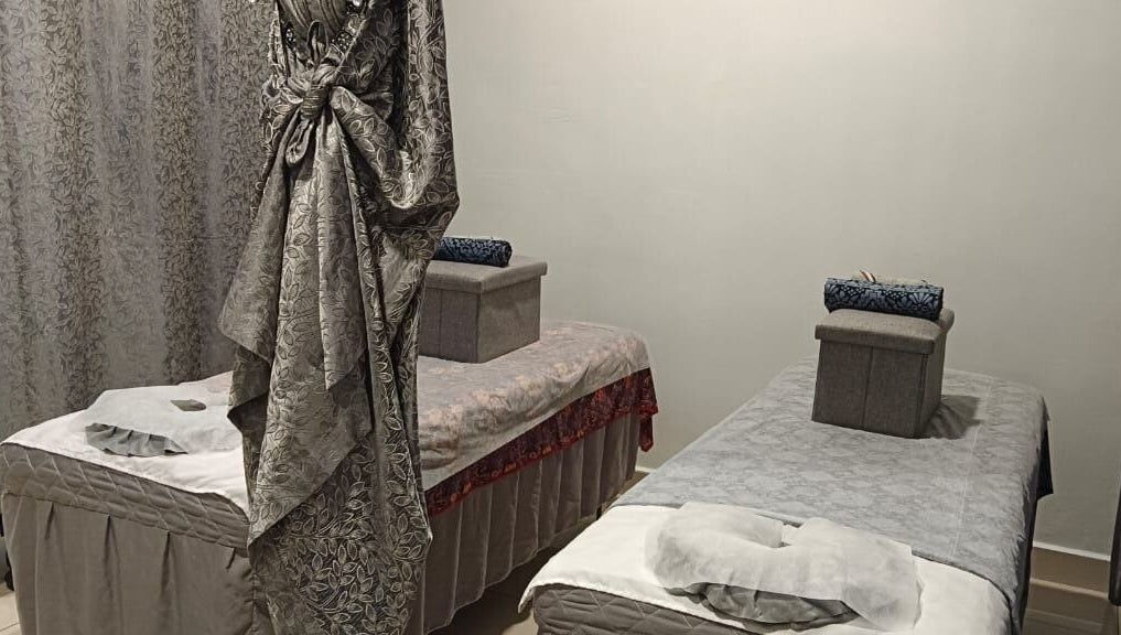 Relaxing massage room at De Borneo Hair & Spa, Langkawi, Kedah, MY with two plush massage tables.