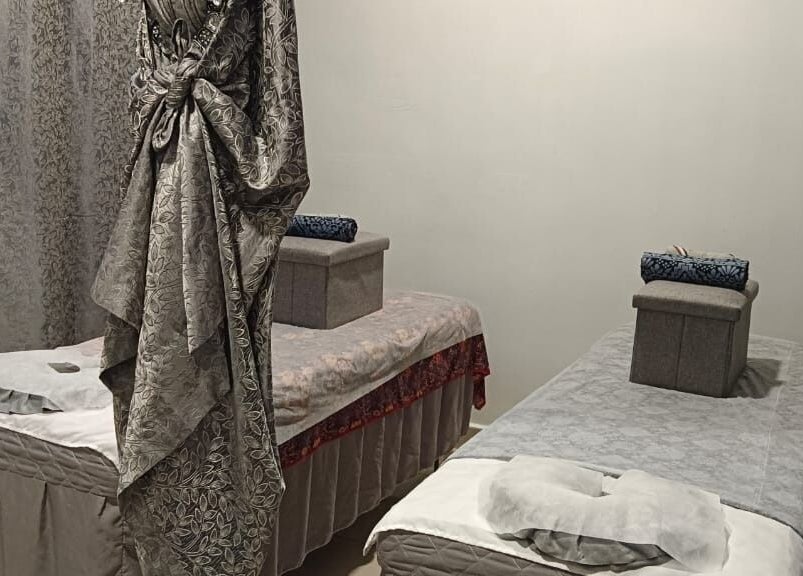 Relaxing massage room at De Borneo Hair & Spa, Langkawi, Kedah, MY with two plush massage tables.