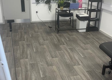 Modern therapy room at High Pavement House, Sutton-in-ashfield, England, GB with elegant flooring and desk.