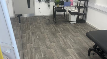 Modern therapy room at High Pavement House, Sutton-in-ashfield, England, GB with elegant flooring and desk.