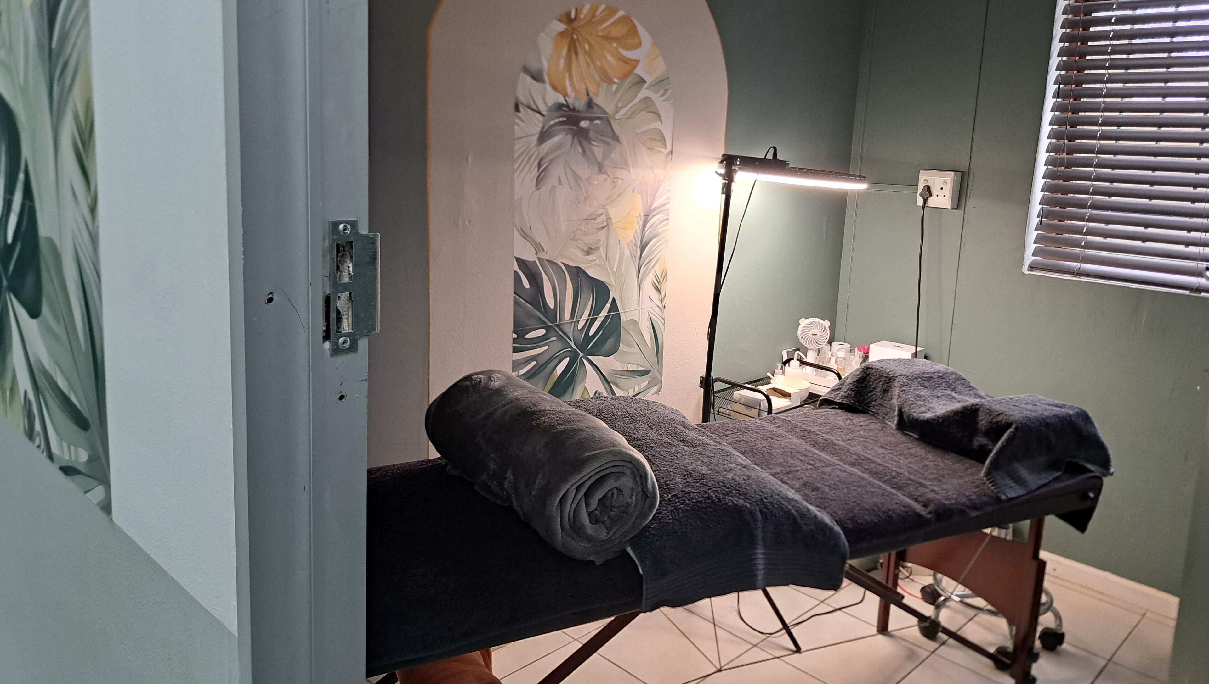 Massage table in calming room at Le Lash and Brow Artist, Cape Town, Western Cape, ZA.