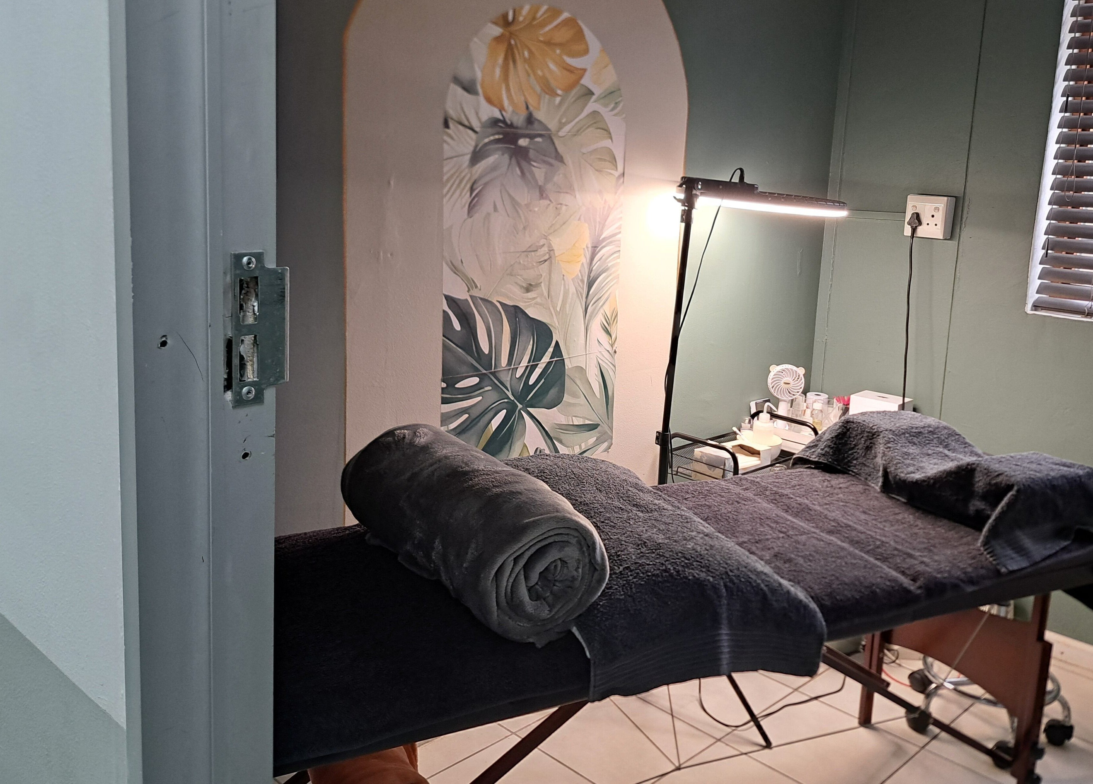Massage table in calming room at Le Lash and Brow Artist, Cape Town, Western Cape, ZA.