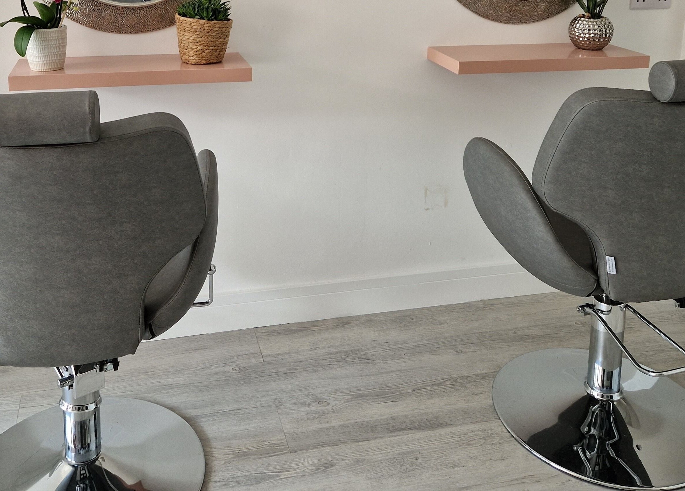 Stylish salon chairs at Contour & Glow by Sej, Wellingborough, England, GB.