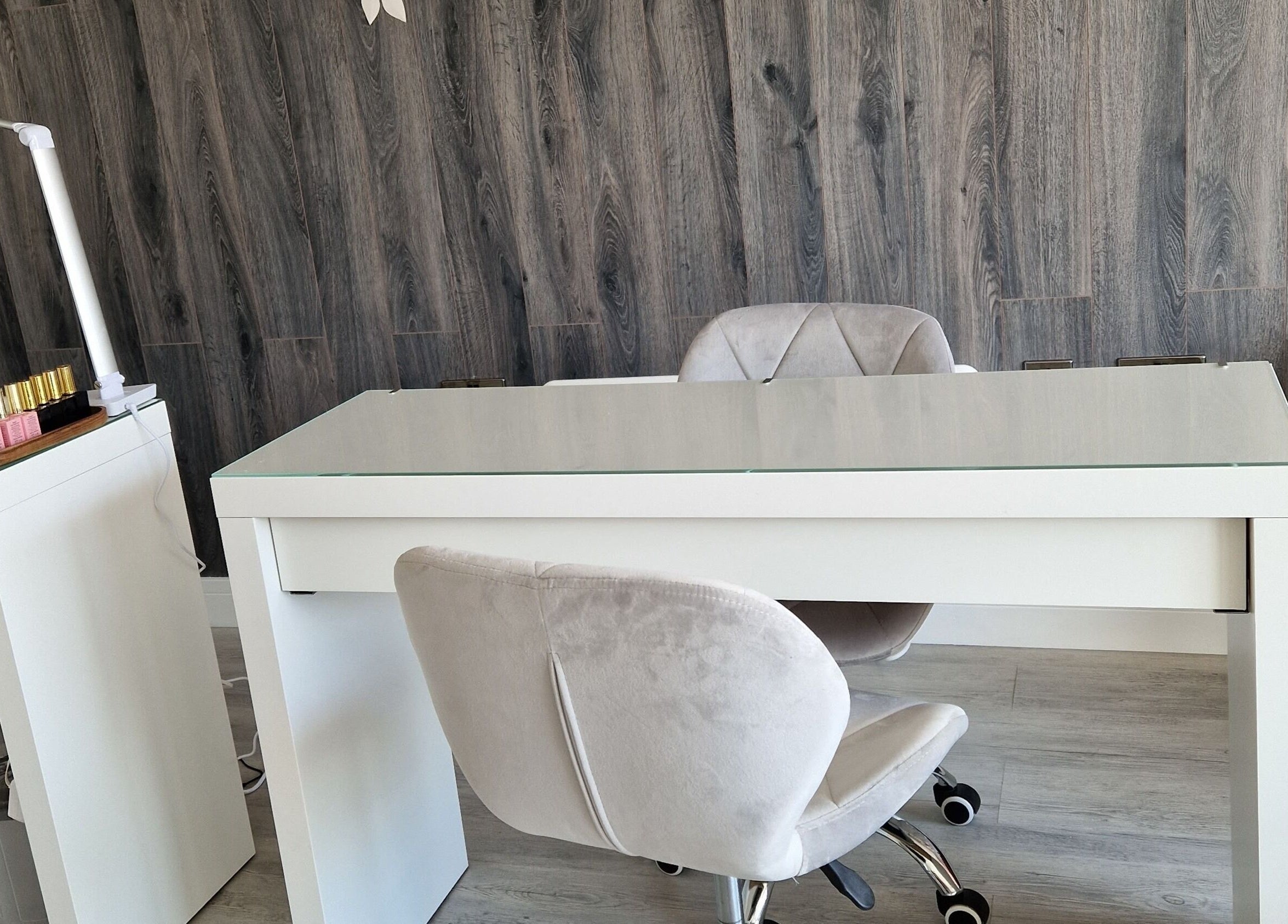 Chic salon station at Contour & Glow by Sej, Wellingborough, England, GB featuring plush chairs.