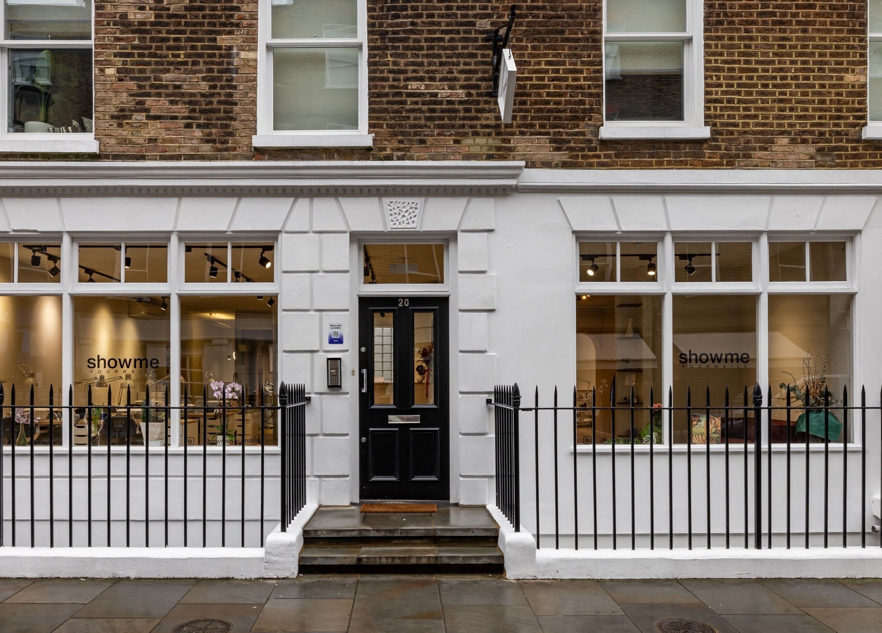 Exterior of Show Me Your Nails salon in London, England, GB showcasing elegant storefront design.