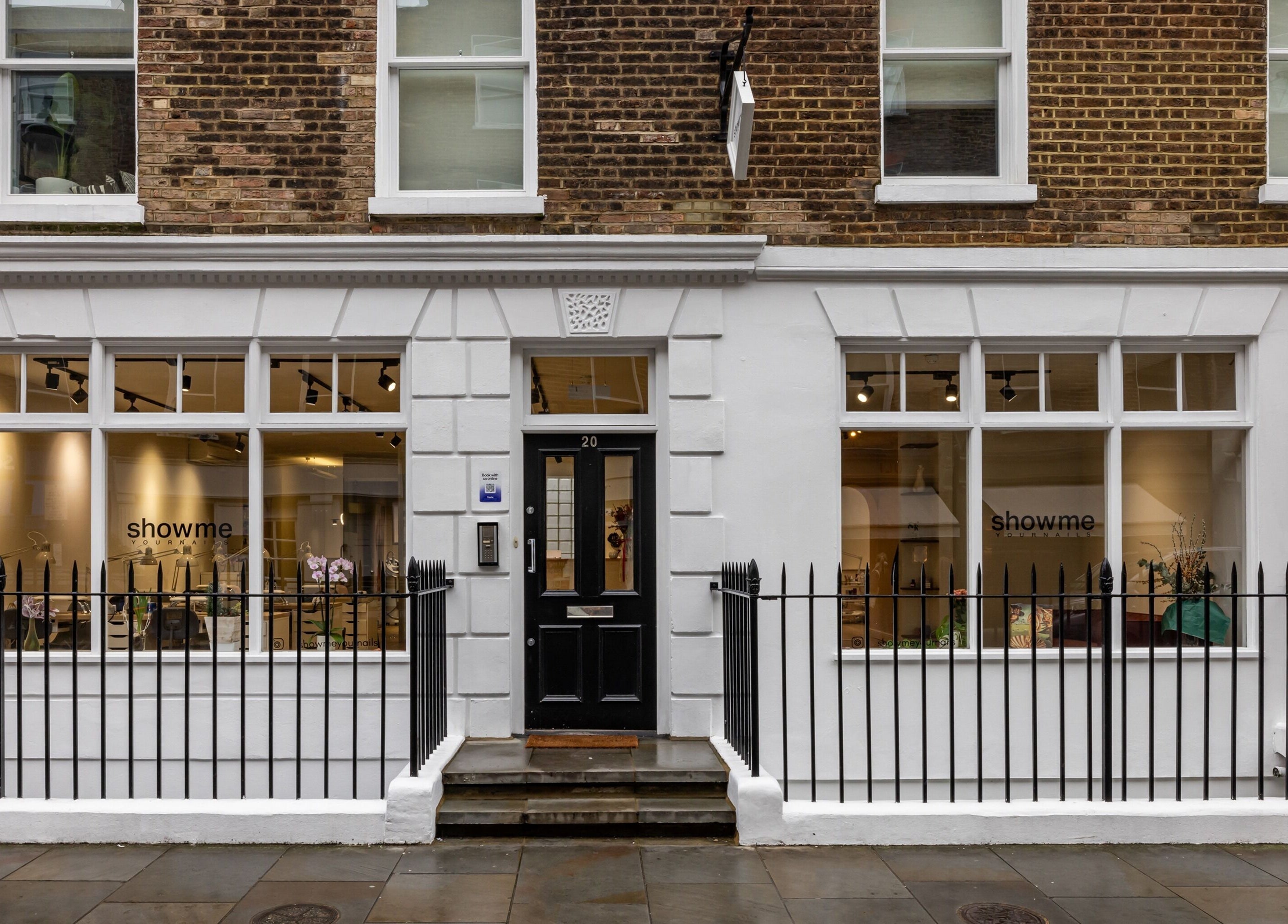Exterior of Show Me Your Nails salon in London, England, GB showcasing elegant storefront design.