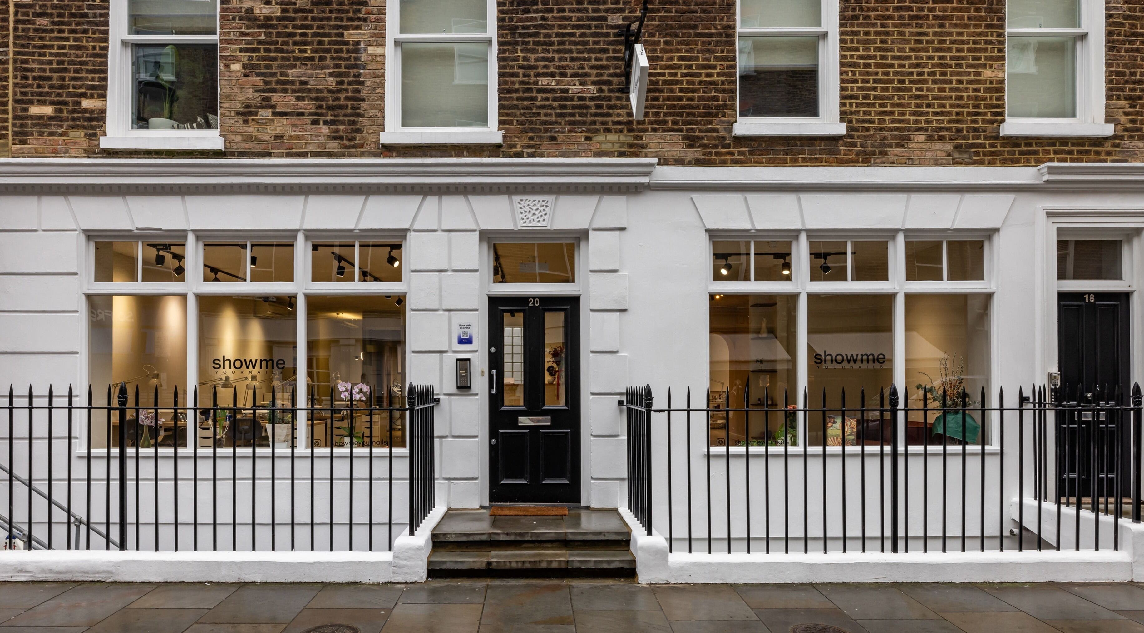 Exterior of Show Me Your Nails salon in London, England, GB showcasing elegant storefront design.
