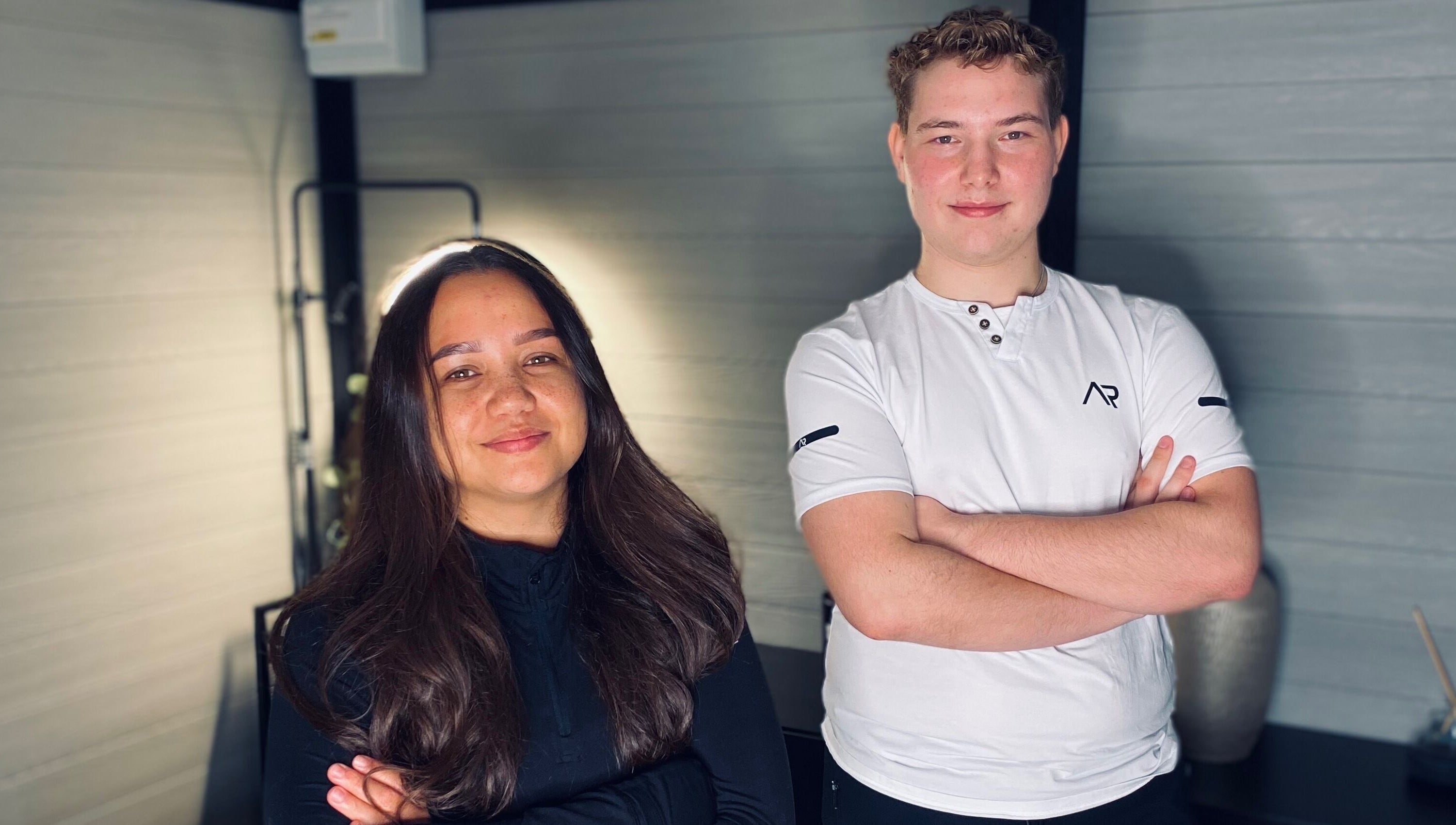 Staff at Healing Muscles Northampton, Overstone, England, GB, smiling in a serene therapy room.