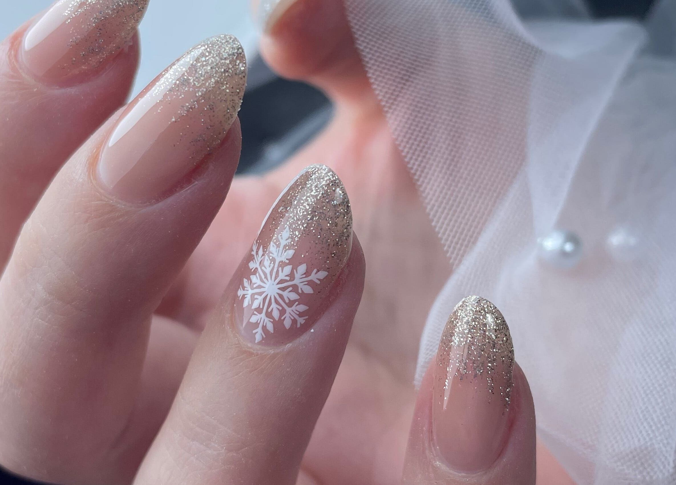Elegant snowflake nail art with glitter finish at Lady Nails Justyna, Cork, County Cork, IE.