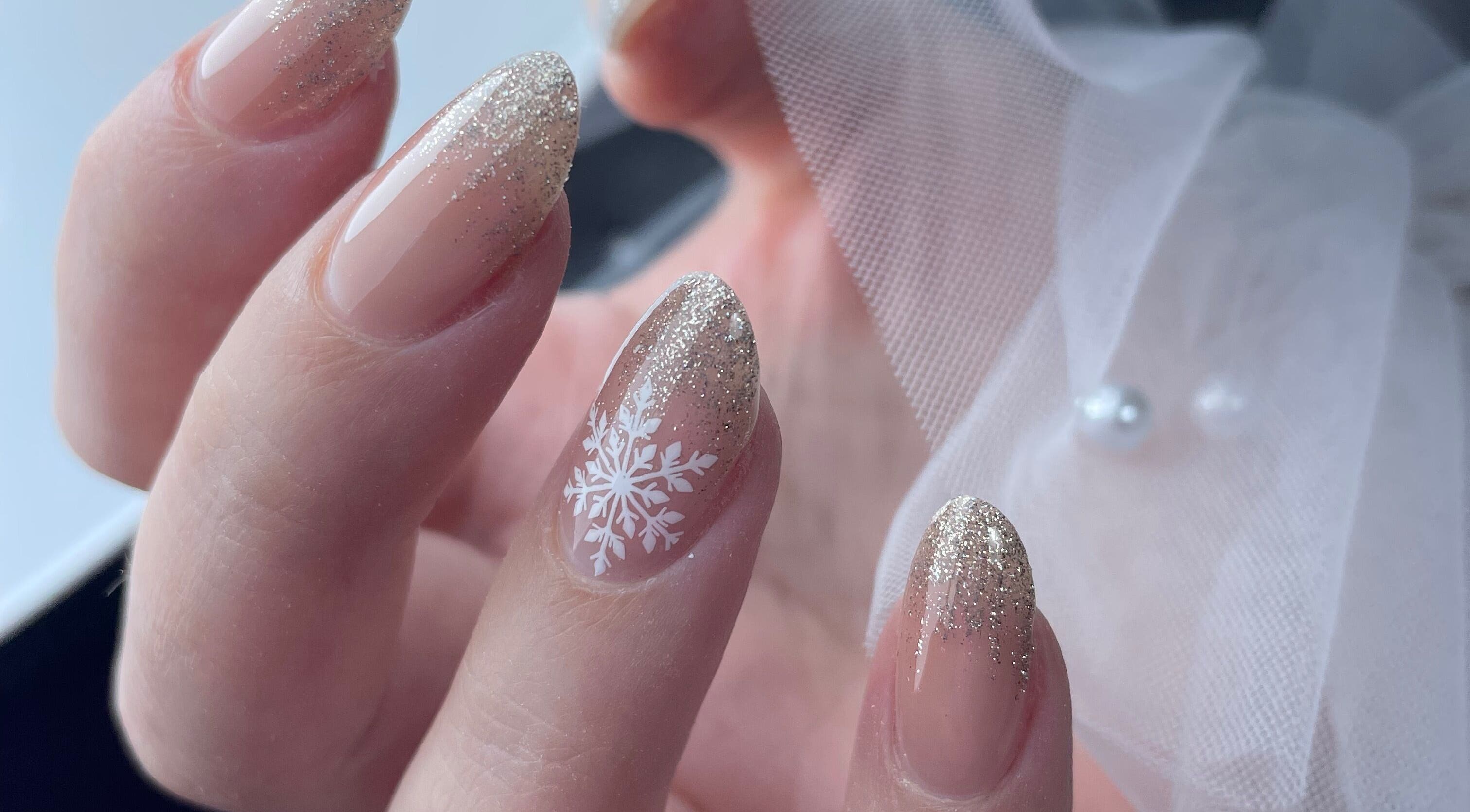 Elegant snowflake nail art with glitter finish at Lady Nails Justyna, Cork, County Cork, IE.