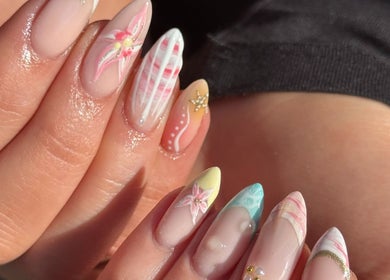Elegant floral nail art design at Eleven Beauty Studio, Keighley, England, GB showcases intricate detail.