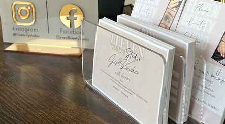 Gift vouchers at Eleven Beauty Studio, Keighley, England, GB, elegantly displayed on a wooden surface.