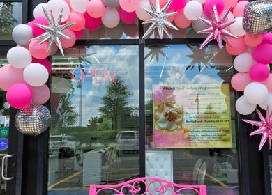 Plush Nail Salon Ii entrance decorated with pink and silver balloons in Glenview, Illinois, US.