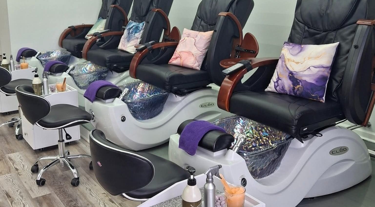 Elegant pedicure seats at Plush Nail Salon Ii, Glenview, Illinois, US, featuring chic decor and amenities.