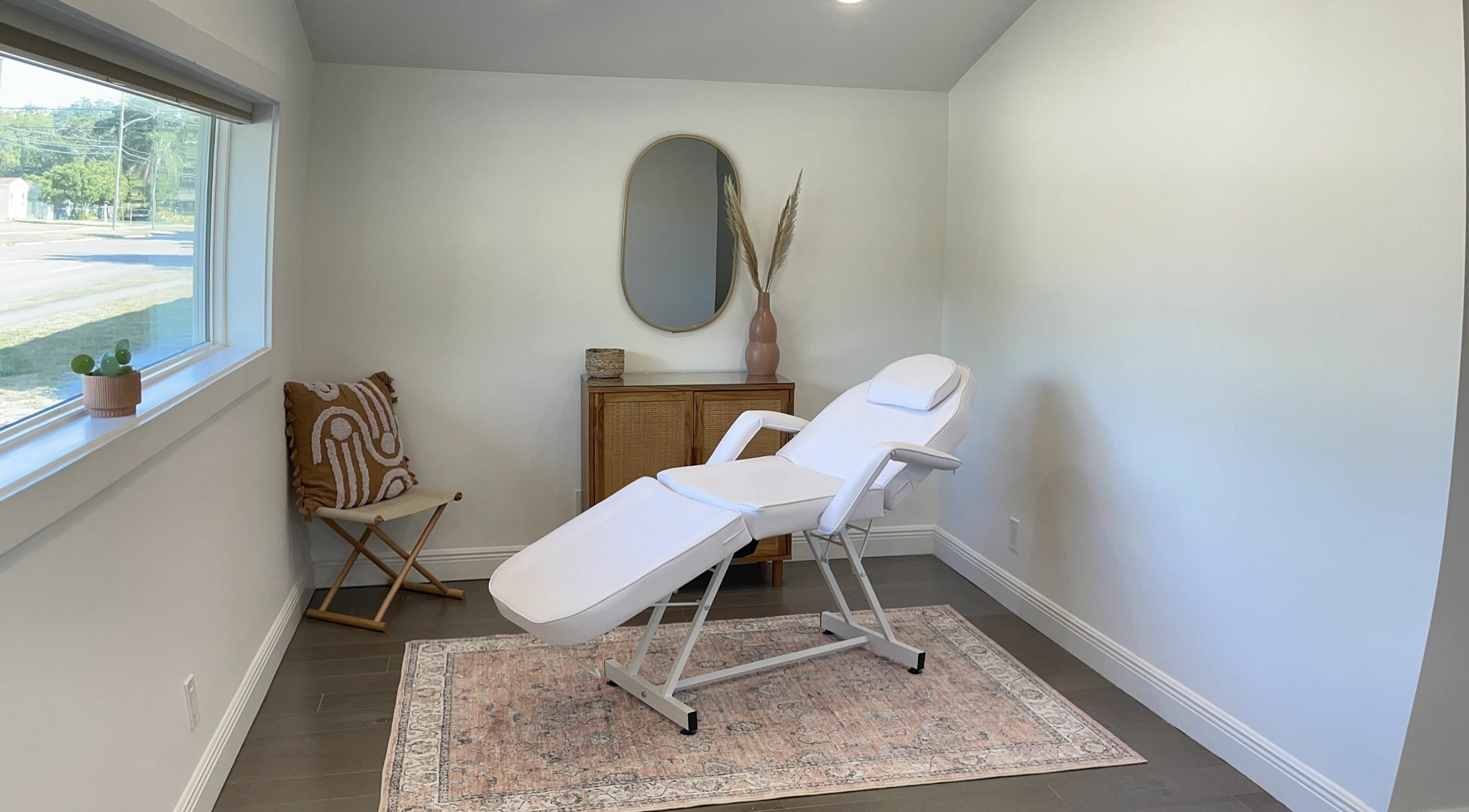 Relaxing spa treatment room at Sugar South in St. Petersburg, Florida, US, featuring a comfortable treatment chair.