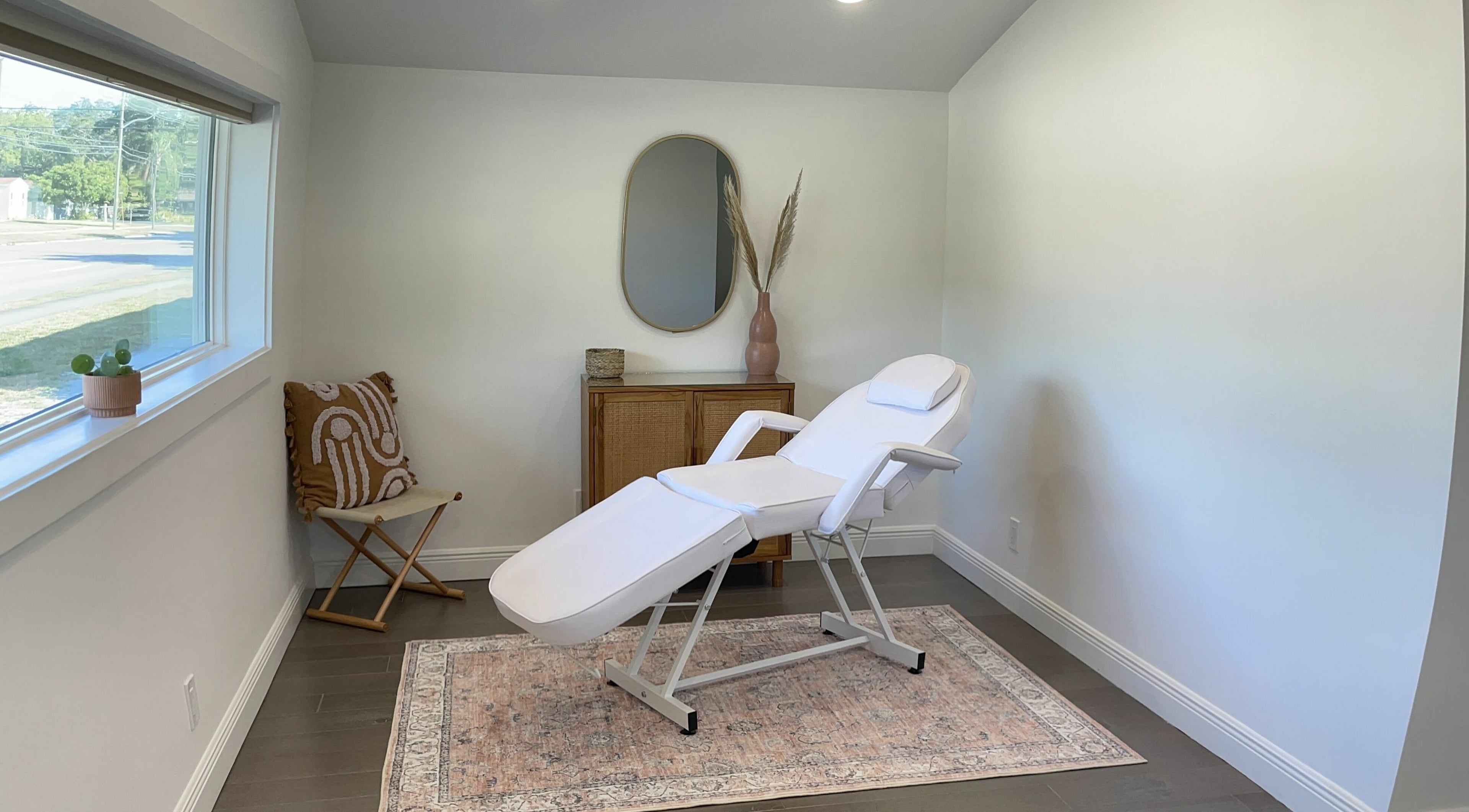 Relaxing spa treatment room at Sugar South in St. Petersburg, Florida, US, featuring a comfortable treatment chair.