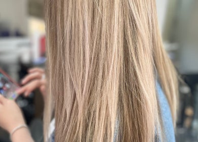 Close-up of long blonde hair in salon at Beauty From The Heart, Belper, England, GB.