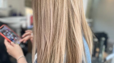 Close-up of long blonde hair in salon at Beauty From The Heart, Belper, England, GB.