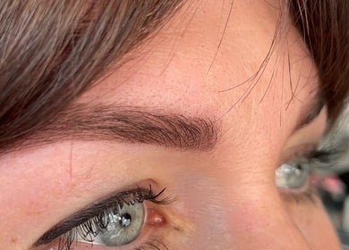 Beautifully shaped eyebrows at Beauty From The Heart, Belper, England, GB enhance this close-up portrait.