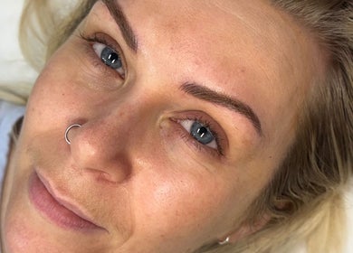 Client with well-groomed eyebrows at Alexandra Beauty, Norwich, England, GB showcasing natural beauty.
