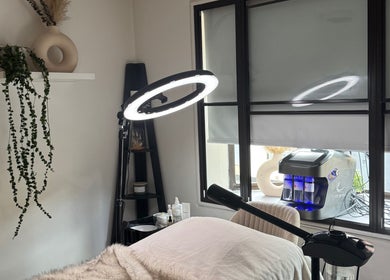 Serene treatment room at Alexandra Beauty, Norwich, England, GB with lush decor and advanced equipment.