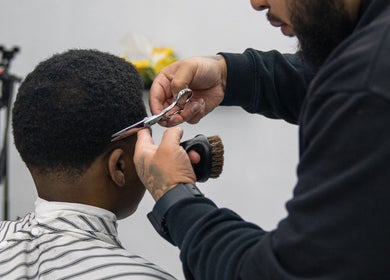 Stylist perfecting a haircut at Crown Barbershop Blacktown, New South Wales, AU.