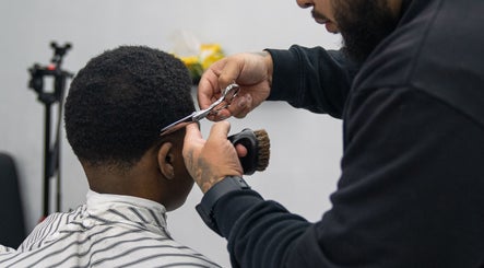 Stylist perfecting a haircut at Crown Barbershop Blacktown, New South Wales, AU.