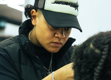 Skilled barber at work in Crown Barbershop Blacktown, Blacktown, New South Wales, AU, styling hair.
