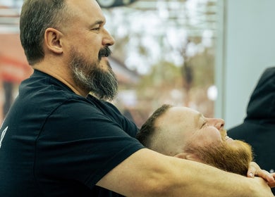Customer enjoying a haircut at Crown Barbershop Blacktown in New South Wales, AU.