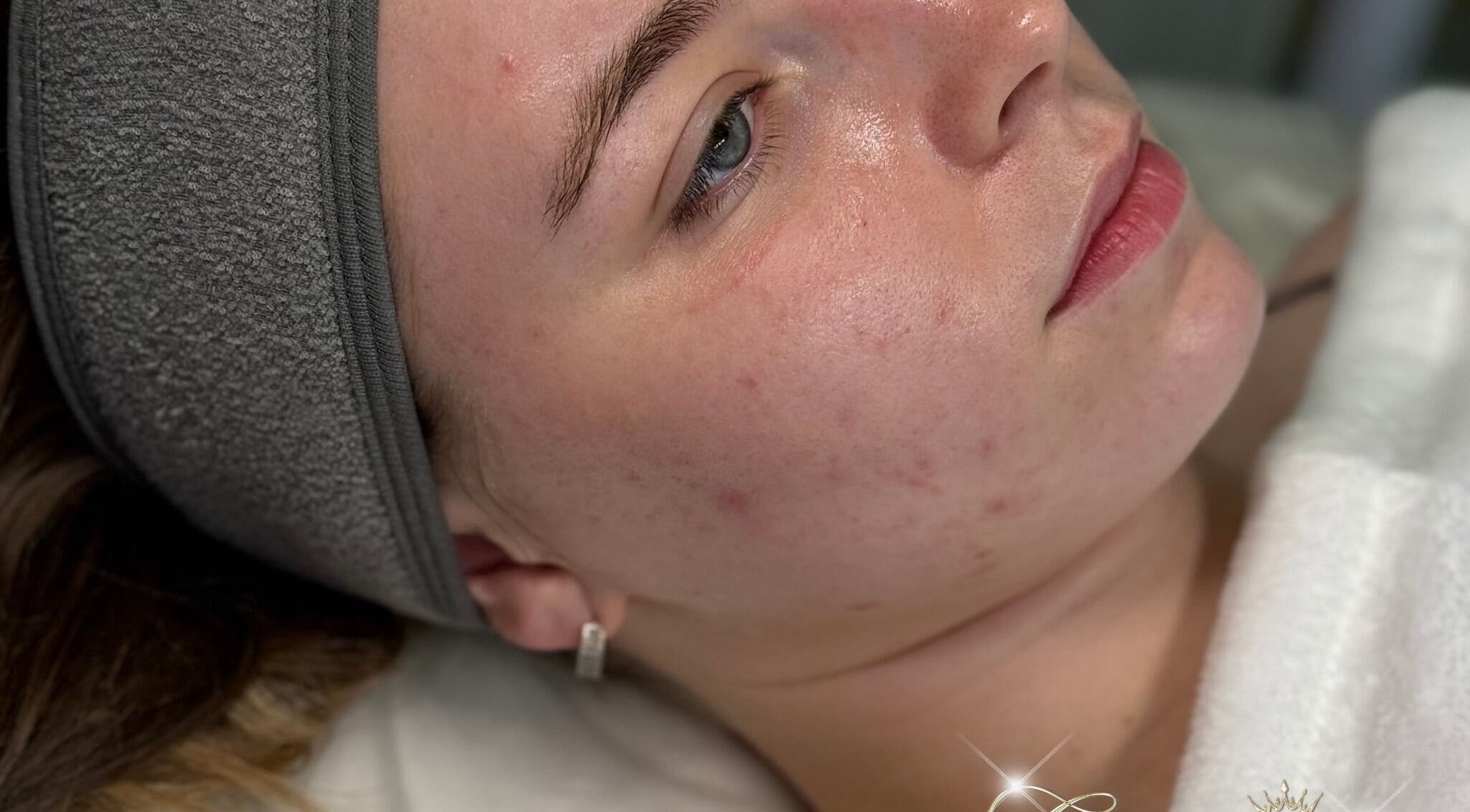 Relaxed woman receiving skincare treatment at Glamour Empire, Hull, England, GB. Focus on serene facial experience.