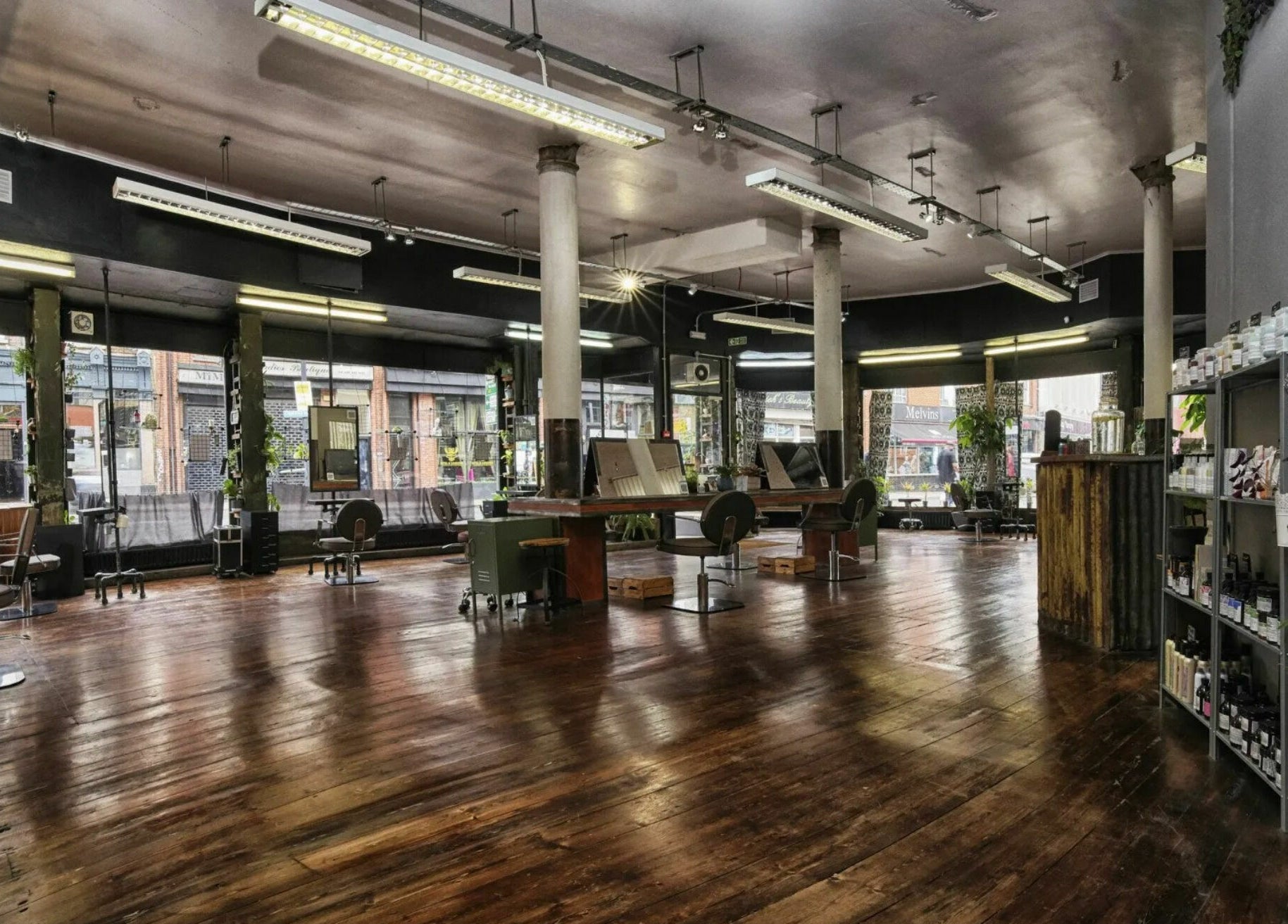 Spacious beauty salon at The Bohemians, London, England, GB with elegant interiors and hardwood floors.