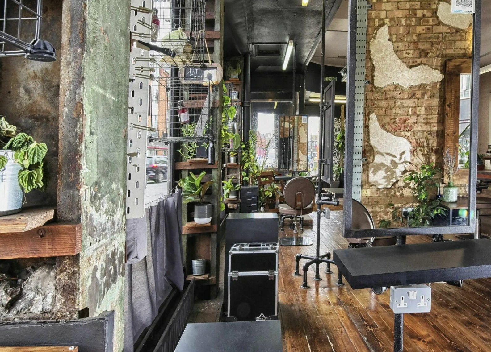 Chic interior of The Bohemians salon with plants and rustic decor, London, England, GB.